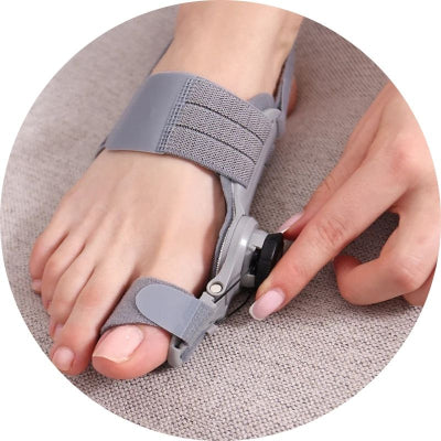 Gray bunion corrector being worn on a foot with a neutral background