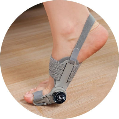 Foot with a bunion corrector on a wooden floor