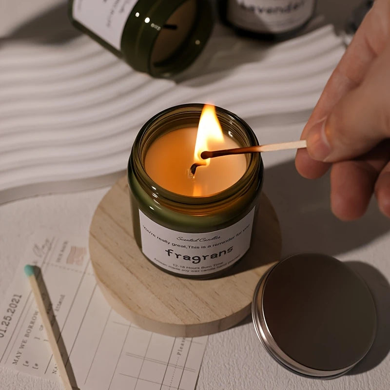 Candle being lit with a match on a table with a blurred background